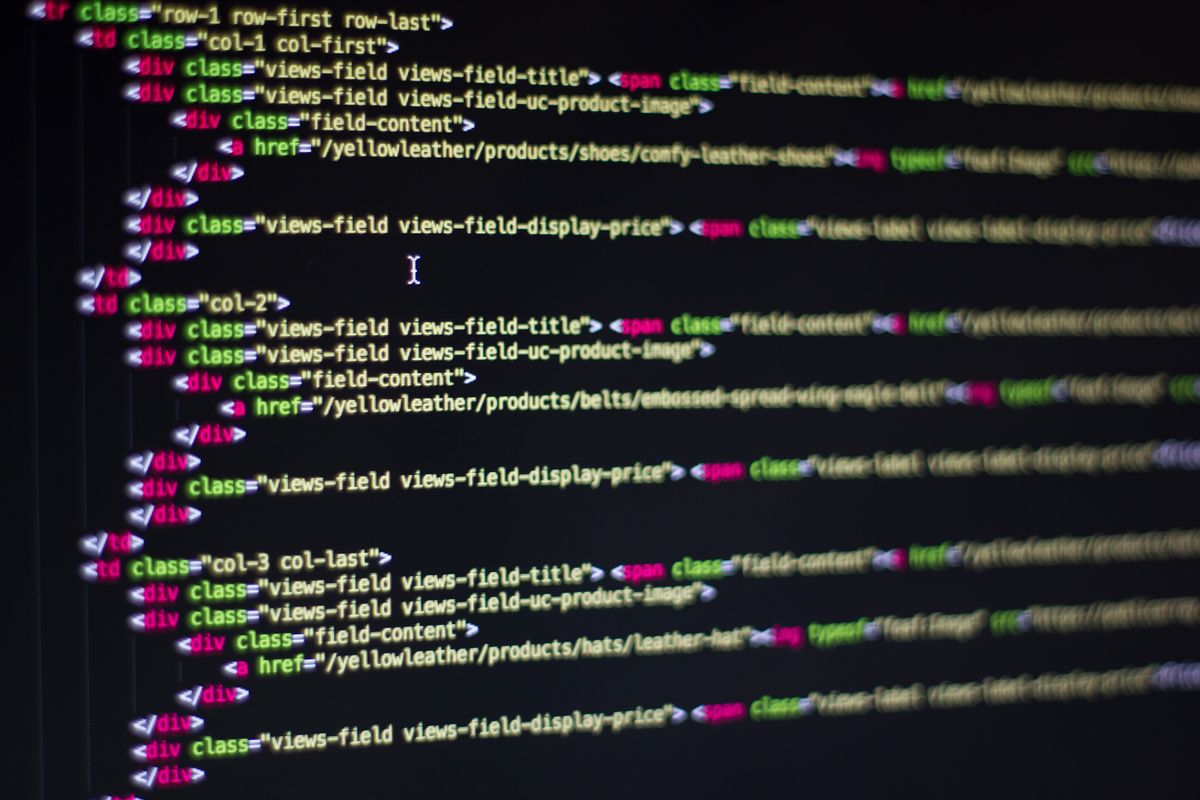 Developer working on website code on a computer