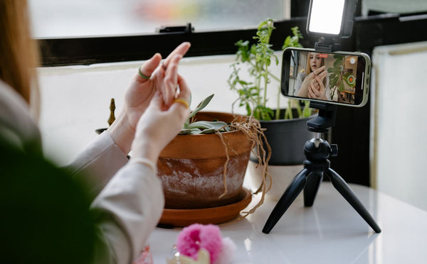 Content creator recording video with a tripod