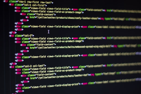 Developer working on website code on a computer