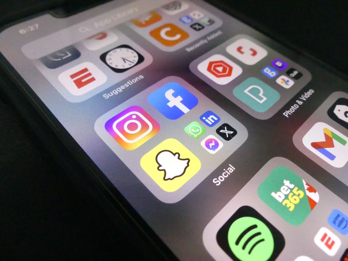 Smartphone displaying popular social media apps